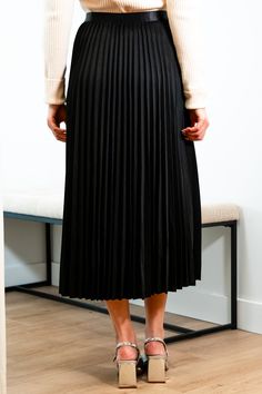 Get ready for an evening out with our Victoria skirt. Featuring a luxurious black accordion pleated design, this midi length skirt exudes elegance and refinement. Elevate any outfit with this chic and sophisticated piece. Elastic satin waistband Mary Grace is wearing XS/S with a 32B bust, 25” waist and 36” hip. 95% Polyester, 5% Spandex Hand wash cold and line dry