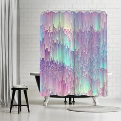 a shower curtain with multicolored lines on it in a white room next to a bathtub