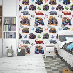 a room with a bed, bookcase and wallpaper that has monster trucks on it