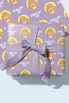 two wrapped presents with the faces of women on them