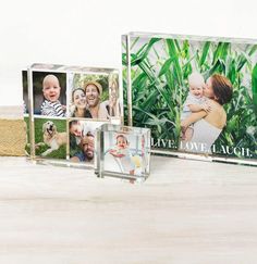 three glass blocks with photos on them