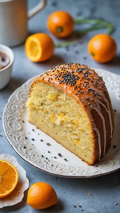 a slice of cake on a plate with oranges around it