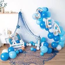 blue and white balloons are on the floor