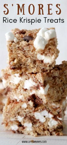 three pieces of rice krispie treats stacked on top of each other with marshmallows