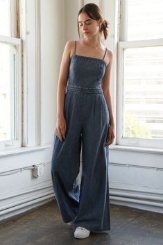 An acid washed jumpsuit featuring straight neckline, adjustable straps, braided waist band, front pleats, side pockets, wide leg and back zipper closure Details: Self : 90% Cotton 10% Polyester Size & Fit - Model is 5`9" And Wearing Size Small- Measurements Taken From Size Small- Approx. Length: 58" Summer Light Wash Wide Leg Denim Jumpsuit, Light Wash Wide Leg Denim Jumpsuit For Summer, Summer Dark Wash Overalls With Adjustable Straps, Spring Dark Wash Denim Jumpsuit With Adjustable Straps, Trendy Denim Jumpsuits And Rompers With Adjustable Straps, Spring Medium Wash Jumpsuits And Rompers With Adjustable Straps, Spring Denim Jumpsuits And Rompers With Adjustable Straps, Summer Washed Wide-leg Denim Jumpsuit, Summer Wide Leg Washed Denim Jumpsuit