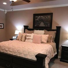 a bedroom with a large bed and two nightstands