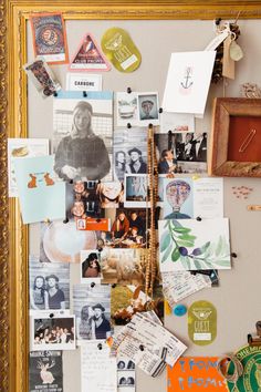 a bulletin board covered in pictures and magnets