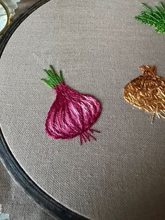 three different types of vegetables on a table top with thread and scissors next to them