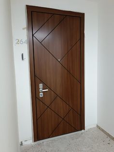 the door is made of wood and has metal handles