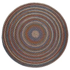 a round rug with multicolored circles on the center and bottom, in various colors