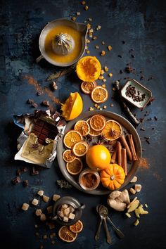 an assortment of oranges and spices on a plate