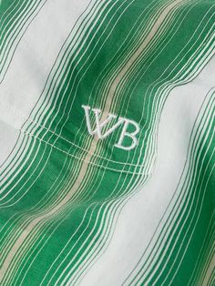 Wales Bonner's 'Cadence' shirt is striped with rows of green and beige stripes that fade into one another. Cut for a relaxed fit, it has a contrasting poplin grandad collar and cuffs and buttoned flap pockets, one is embroidered with the brand's initials. District Vision, Wales Bonner, Formal Shirts, Suede Jacket, Collar And Cuff, Striped Shirt, Wales, Casual Shirts, Initials