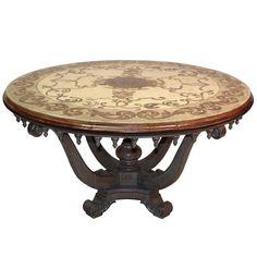 an ornately decorated wooden table with marble top