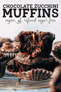 chocolate zucchini muffins stacked on top of each other with text overlay