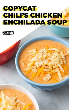 two bowls of soup with cheese and crackers on top, one bowl is filled with cheesy chicken enchilada soup