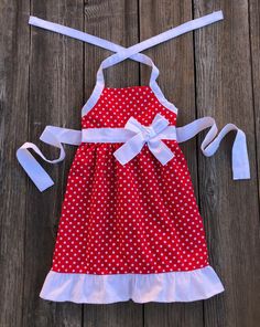 Red White Polka Dot Dress This cute custom boutique red white polka dot dress would be perfect for a fun day out in the sun. Dress is halter style, red white polka dot with white trim. Your baby girl will definitely stand out in this one. 100% Cotton Polka Dot Theme Wash Warm tumble dry low iron if needed Made To Order MADE IN USA Dresses 50s Style, Bug Clothing, 4th Of July Dresses, Minnie Mouse Outfits, White Polka Dot Dress, Fun Day, 50s Fashion, Halter Style, Sun Dress