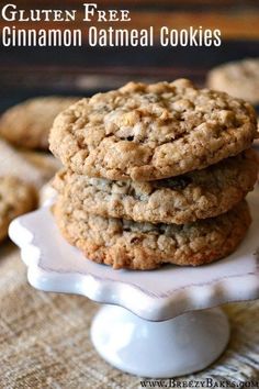 three oatmeal cookies stacked on top of each other in a white plate