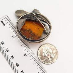 Unfortunately, stone is slightly chipped, but can be easily replaced by your local jeweler.800 Silver Vintage Real Large Amber Calla Lily Floral Pin BroochWeight: 19.8gWELCOME TO PAWN SHOPWe are an actual pawn shop and have been in business for over 25 years.Since 1990, our establishment has been serving a variety of clients by providing them with short term cash solutions and options of liquidity regarding their treasured heirlooms.Acknowledging that today′s customers are very sophisticated and Collectible Round Gemstone Brooch, Collectible Round Gemstone Brooches, Amber Brooch Jewelry Gift, Floral Pins, Swirl Ring, Sun Designs, Amber Earrings, Pawn Shop, Calla Lily