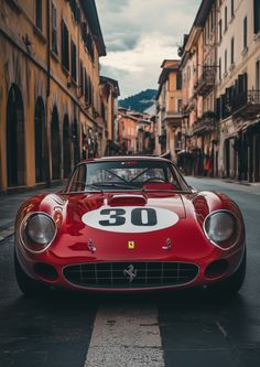 a red sports car is parked on the street