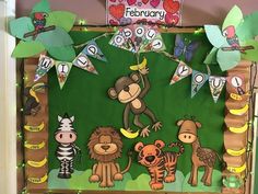 a bulletin board decorated with animals and trees