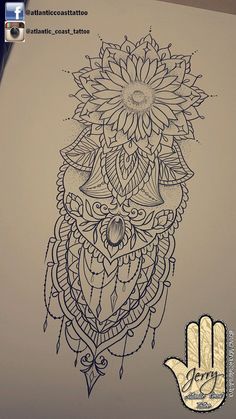 a drawing of an owl with flowers on it's head and the hand next to it