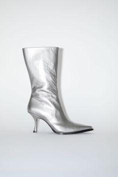 Acne Studios silver boots are crafted from leather with a wrinkled finish and western-inspired construction. Detailed with a pointed toe and thin heel. Leather Heel Boots, Silver Boots, Leather Heeled Boots, Winter Essentials, Heel Boots, Small Leather Goods, Sunglass Frames, Leather Fashion, Cow Leather