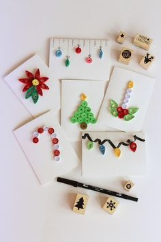 some christmas themed items are laid out on a table with a ruler and pencil in the foreground