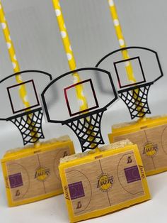 three basketball themed place cards with candles in them