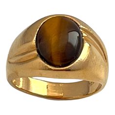 Vintage Ring Tiger's Eye 14k Gold Electroplate Gorgeous 14kt Gold Plated Ring With Tiger's Eye Cabochon. Vintage Mid-Century Design Genuine Vintage Never Worn Before! Stamped: 14ktge With Maker's Mark Please Note, More Than One Ring Is Available. Due To The Variations Of Natural Stones, The Tiger's Eye Design Will Differ For Each Piece And May Not Match The Design Photographed. This Exceptional Vintage Piece Had Been Tucked Away In Storage For Decades! Newly Discovered So You Can Enjoy It Now! 1 Vintage Mens Jewelry, Mid Century Colors, Mens Accessories Jewelry, Eye Design, Plated Ring, Gold Plated Rings, Maker's Mark, Tiger's Eye, One Ring