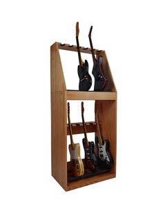 a wooden shelf with guitars and other musical instruments on it's sides, in front of a white background