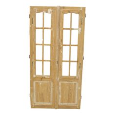 an old wooden double door with windows on the front and side panels, isolated against a white background