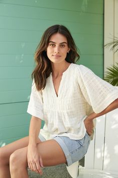 The Tulum top from Australian brand Little Lies is a perfect staple for spring/summer. Features pleated detail on the front, a flattering square sleeve and a v-neckline. This gorgeous top is an oversized fit that can be paired with your favorite pants or shorts. Semi-sheer. Materials: 100% Cotton Care: Wash with like colors; cold gentle machine wash; do not bleach; lay flat to dry; warm iron; do not tumble dry. Size Info: Model is 5'8" and is wearing a size S; relaxed fit Size Guide | Shipping Policy Accessories Boutique, Jersey City, Boutique Accessories, Linen Pants, Tulum, Skirt Pants, Girls Shopping, Dress Shop, Bell Sleeve Top