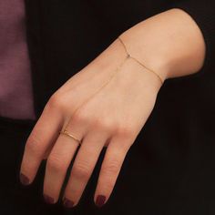 This handchain bracelet with minimalist style is simple but outstanding. Finely crafted from sterling silver, available with five gemstones to fit your style. You'll never want to take this off! Metal: 925 sterling silver; optional 18k yellow / rose gold vermeil Adjustable ring fits sizes from 5 to 8 US Chain style: cable-link Clasp: spring ring Gemstones: onyx, amethyst, ruby, emerald, sapphire Hypoallergenic: nickel-free materials used therefore suitable for those with metal allergies Minimal Ring, Ruby Emerald, Bracelet Ring, Hand Chain, Ring Fit, Yellow Roses, Adjustable Ring, Yellow Rose, Minimalist Style