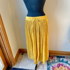 H&M Midi Skirt Satin Pleated Stretch Mustard Yellow Gold Nwt New With Tags. No Flaws Noted. Brand: H&M Midi Skirt Size Small Golden Yellow Color Elasticized Stretch Waistband With Drawstring Ties Silky Satin Texture Pleated Polyester Measurements Are Approximate With Item Laying Flat: Waist: 26” Unstretched, Stretches To 38" Length: 33” From A Smoke Free, Pet Friendly Home. Yellow Summer Maxi Skirt With Elastic Waistband, Yellow Long Skirt For Fall, Pleated Yellow Skirt For Work, H&m Pleated Summer Bottoms, H&m Pleated Skirt For Spring, Yellow Skirt With Elastic Waistband, Yellow Relaxed Skirt Bottoms With Elastic Waistband, Yellow Wide Leg Maxi Skirt For Spring, Chic Yellow Maxi Skirt For Spring