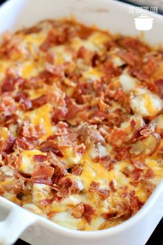 a white casserole dish filled with bacon and cheese