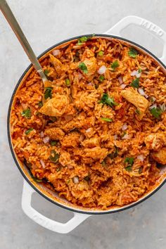 a large pot filled with rice and meat