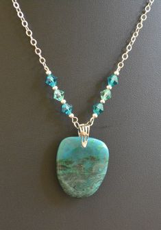 This exquisite handmade necklace features a stunning hand-polished chrysocolla gemstone. Known for its vibrant blue-green hues, chrysocolla is believed to bring tranquility and enhance communication. Each piece is meticulously crafted to ensure the highest quality and uniqueness. Perfect for adding a touch of elegance to any outfit.45 Elegant Handmade Turquoise Chrysocolla Necklace, Handmade Turquoise Malachite Necklaces, Handmade Turquoise Malachite Necklace, Turquoise Necklace For Jewelry Making With Chrysocolla, Chrysocolla Turquoise Necklace For Jewelry Making, Green Chrysocolla Necklaces With Natural Stones, Healing Chrysocolla Pendant Turquoise Necklace, Turquoise Chrysocolla Necklace For Gift, Handmade Green Chrysocolla Necklace