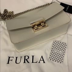 Furla Saffiano Off White New! Gorgeous Off White Furla Bag With Chain Handle. Very Sharp. Nice Color , Good For Summer Or Winter. Great Size 12x 7 X 3 . Feel Free To Ask Questions Luxury White Saffiano Leather Shoulder Bag, White Saffiano Leather Office Bag, White Saffiano Leather Rectangular Bag, Classic White Saffiano Leather Shoulder Bag, White Saffiano Leather Evening Bag, Gold Saffiano Leather Evening Bag, Evening White Saffiano Leather Bag, Everyday Saffiano Leather Bag With Chain Strap, Saffiano Leather Bags With Chain Strap For Everyday Use