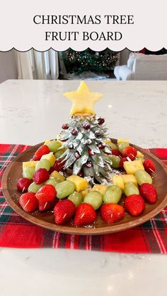 a christmas tree fruit board on a table