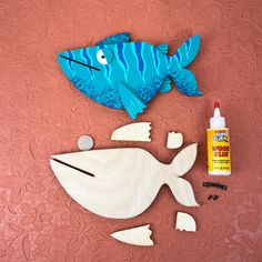 the fish is made out of wood, and glues are used to paint it