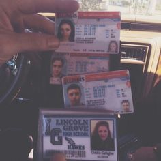 the driver's identification cards have been placed on top of each other