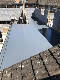 a flat roof being installed on a house