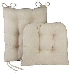 two pillows with ties on them and one has a pillow attached to the back of it