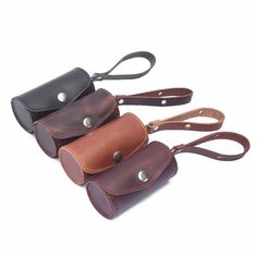 three leather pouches are lined up on top of each other