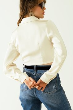 Step into spring with our elegant Satin V-Neck Cream Crop Top. This stunning piece features long sleeves, frontal pockets, and a chic wrap front with a knot detail. Crafted from 100% polyester, this crop top offers a luxurious satin finish that's perfect for any party or special occasion. The bodycon fit and tie fastening ensure a flattering silhouette, while the V-neck neckline adds a touch of sophistication. Please note that this top runs small, so consider sizing up for the perfect fit. Model Info: Model is wearing size S. Model's measurements: 33-25-35, Height: 5'7''. Key Features: Bodycon fit for a flattering silhouette. V-neck neckline and long sleeves for a stylish look. Wrap front with knot detail and chest pockets for added elegance. Made from lightweight satin fabric for a luxuri Crop Top With Long Sleeves, Tan Scarf, Cream Crop Top, Top With Long Sleeves, Color Crema, Neck Cream, Top Crop, Scarf Hat, Top Light