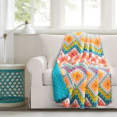 Show off your boho side with this bright and bold throw blanket. The chevron pattern is packed with brilliant designs of dazzling colors. This throw is sure to be the centerpiece of your bedroom. It pairs great with other bohemian-chic inspired decor but also works well mixed with classic, modern, contemporary and transitional design styles. It measures 50 inches by 60 inches making it ideal for single use. This throw blanket is OEKO-TEX® Standard 100 certified, which means the fabric, dyes and Yellow Blanket, Transitional Design Style, Boho Quilt, Lush Decor, Cotton Throw Blanket, Bohemian Colors, Pet Crate, Boho Geometric, Cotton Blanket