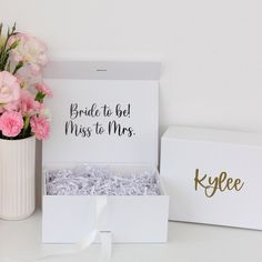 the bride to be gift set includes a card box, vase with flowers and a bouquet of carnations