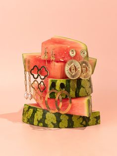 watermelon slices stacked on top of each other with earring rings attached to them