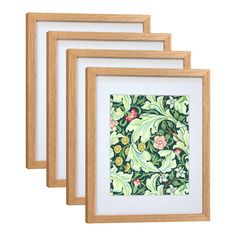 three wooden frames with an image of flowers and leaves painted on the paper in them