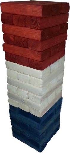 a stack of wooden boards stacked on top of each other with different colors and shapes